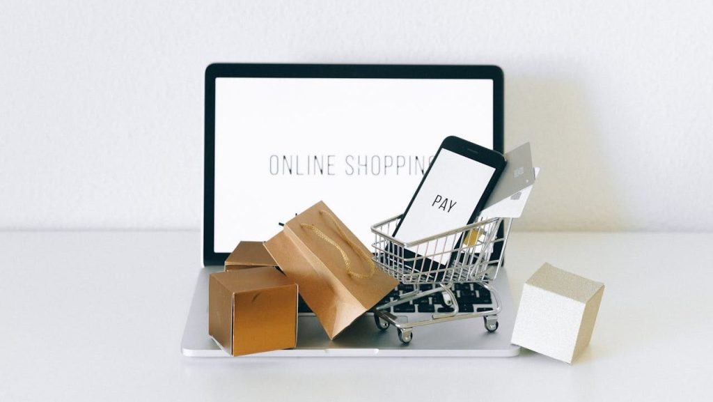 A Miniature Shopping Cart on MacBook Laptop